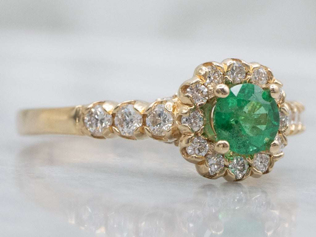 Modern Yellow Gold Emerald and Diamond Halo Ring