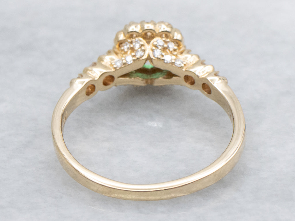 Modern Yellow Gold Emerald and Diamond Halo Ring