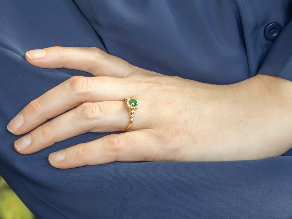 Modern Yellow Gold Emerald and Diamond Halo Ring