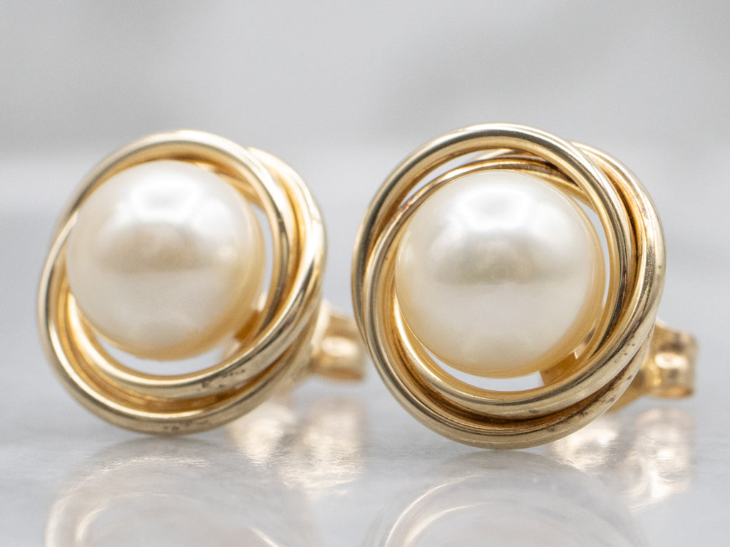 Twisting Yellow Gold Pearl Stud Earrings