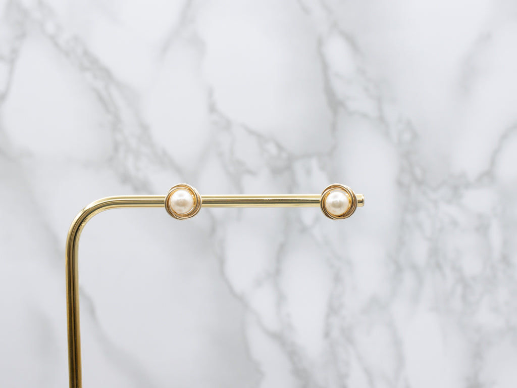 Twisting Yellow Gold Pearl Stud Earrings