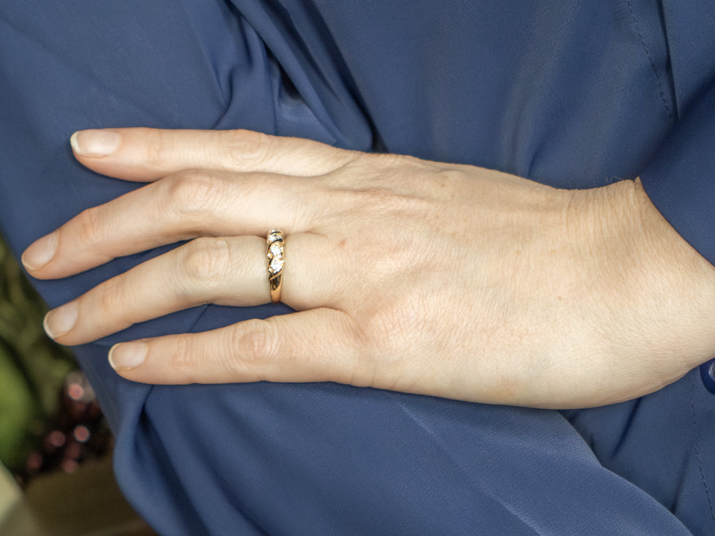 Twisting Gold Graduated Diamond Band