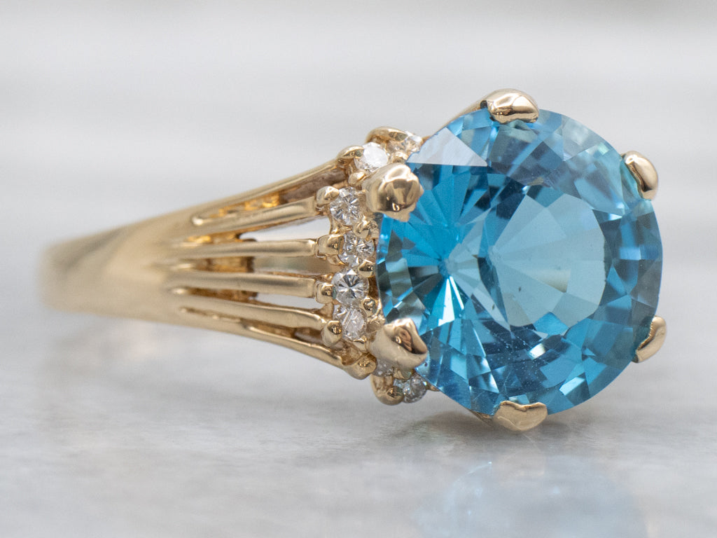 Swiss Blue Topaz and Diamond Gold Split Shank Ring