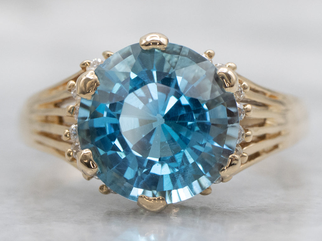 Swiss Blue Topaz and Diamond Gold Split Shank Ring