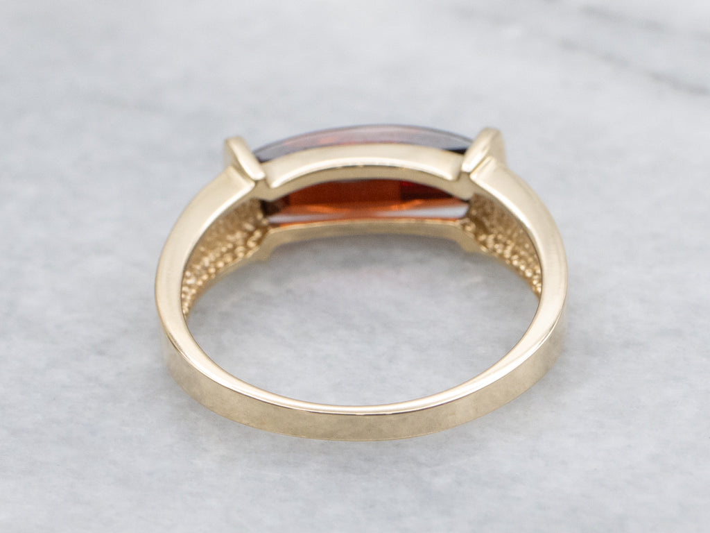 Sleek East-To-West Modern Garnet and Gold Ring