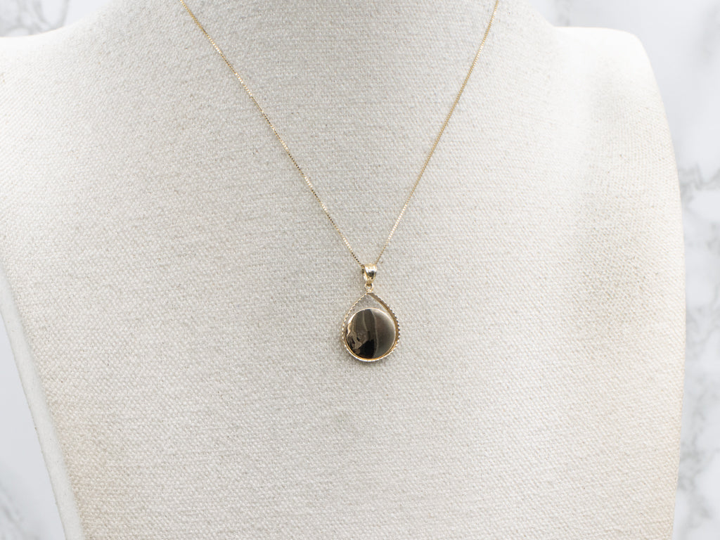 Yellow Gold Teardrop Pendant with Open Disc Center
