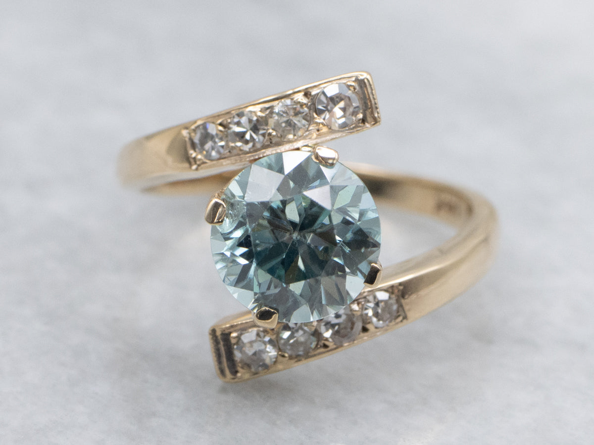 Round Cut Blue Zircon and Diamond Gold Bypass Ring