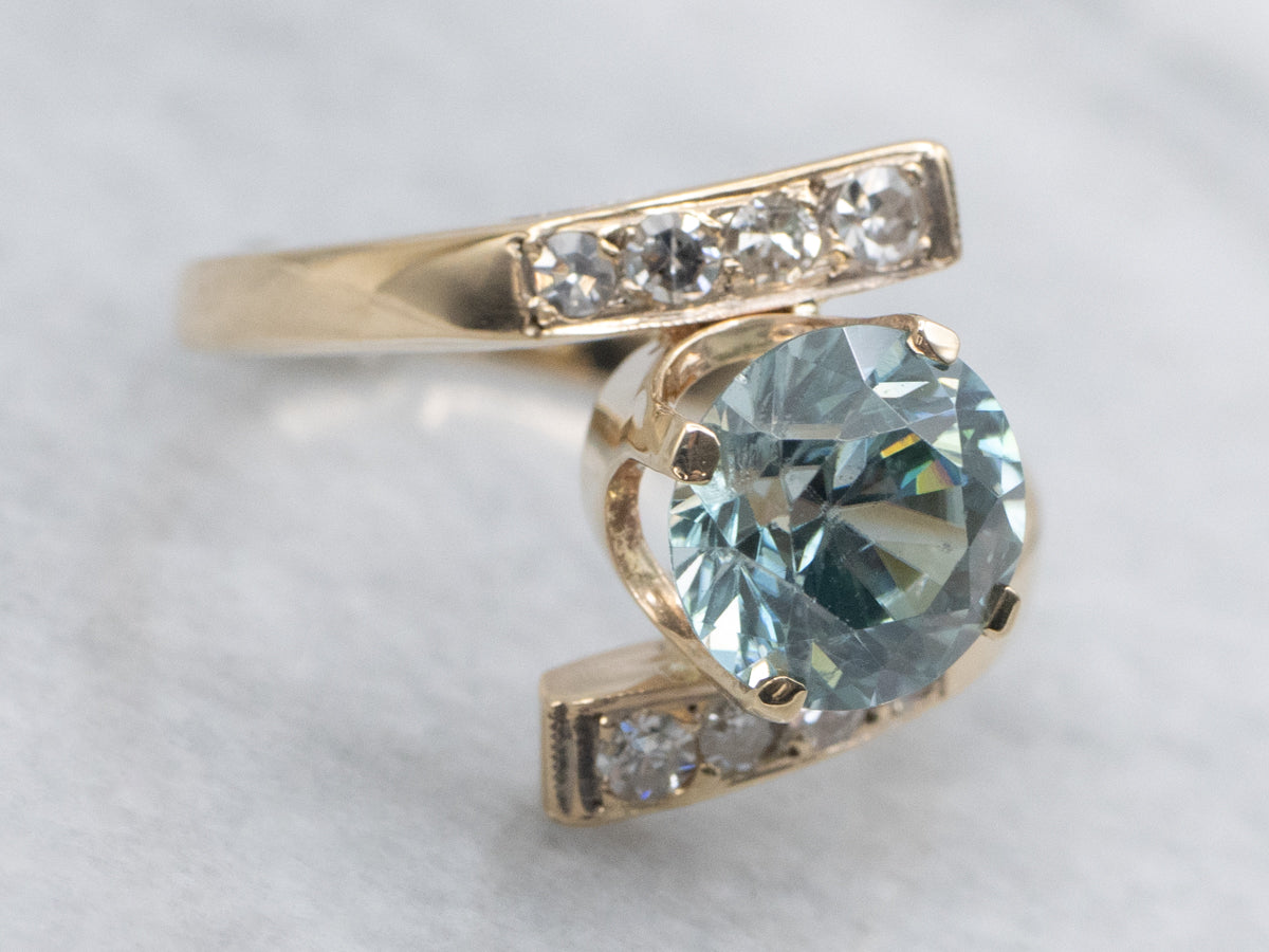 Round Cut Blue Zircon and Diamond Gold Bypass Ring