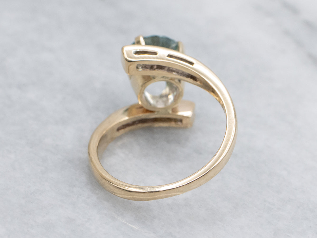 Round Cut Blue Zircon and Diamond Gold Bypass Ring