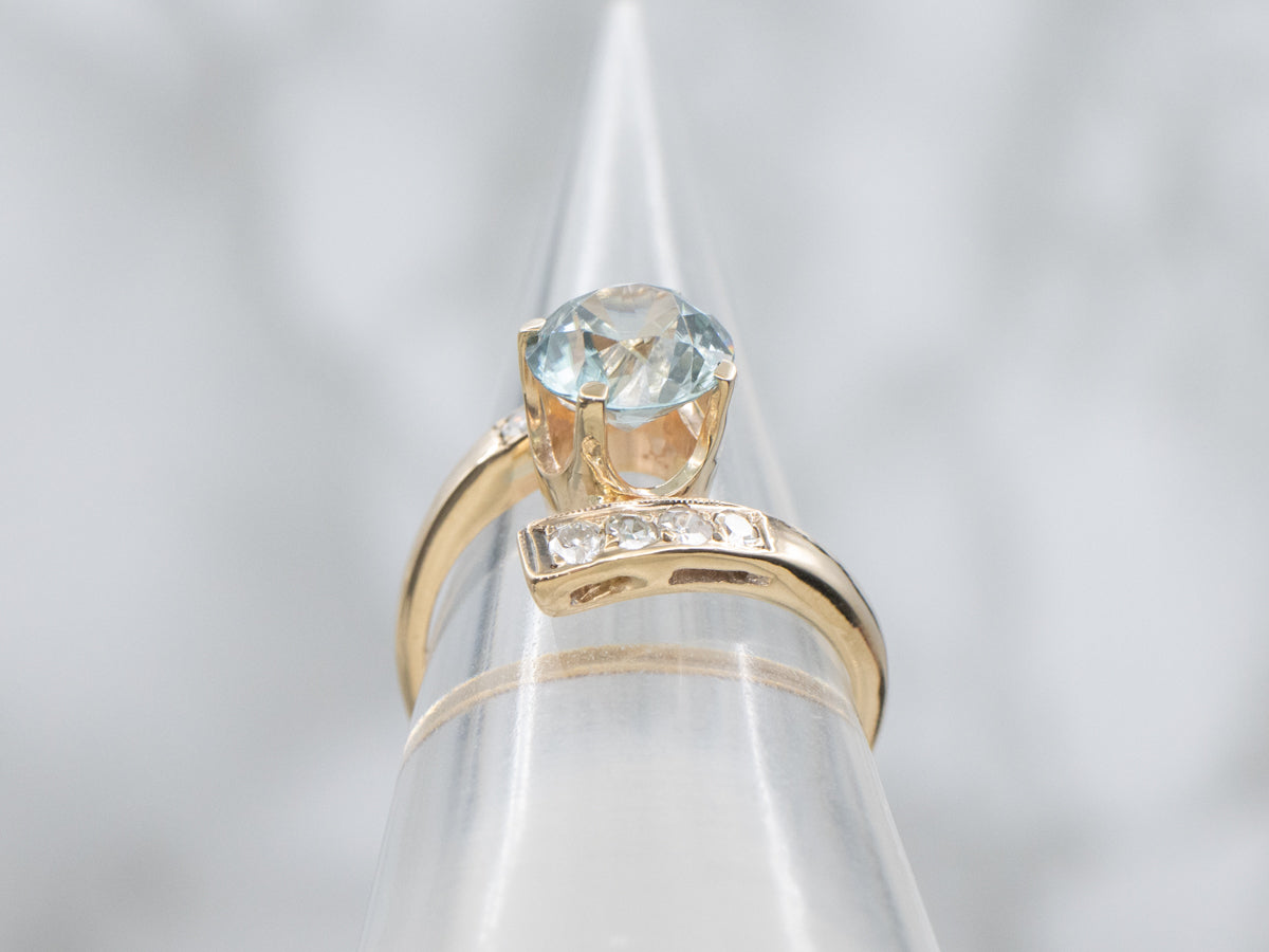 Round Cut Blue Zircon and Diamond Gold Bypass Ring