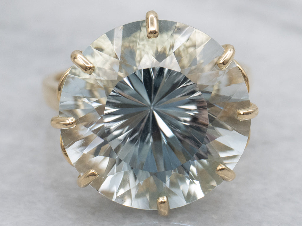 Stunning Round-Cut Blue Topaz and Gold Cocktail Ring