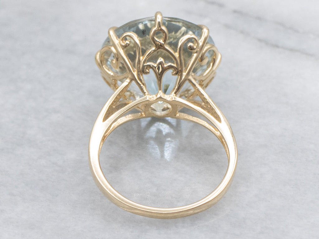 Stunning Round-Cut Blue Topaz and Gold Cocktail Ring