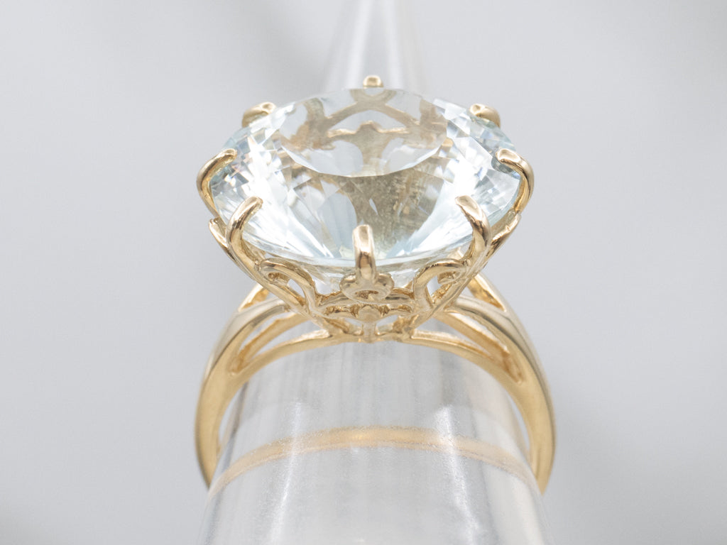 Stunning Round-Cut Blue Topaz and Gold Cocktail Ring