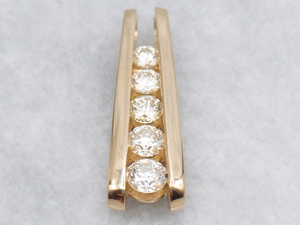 Tension-Set Diamond and Gold Pendant with Hidden Bail