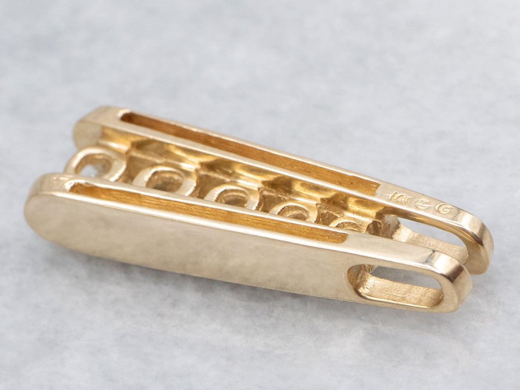 Tension-Set Diamond and Gold Pendant with Hidden Bail