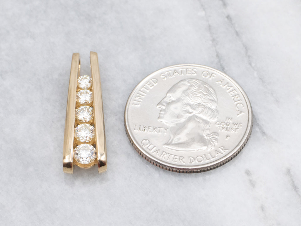Tension-Set Diamond and Gold Pendant with Hidden Bail