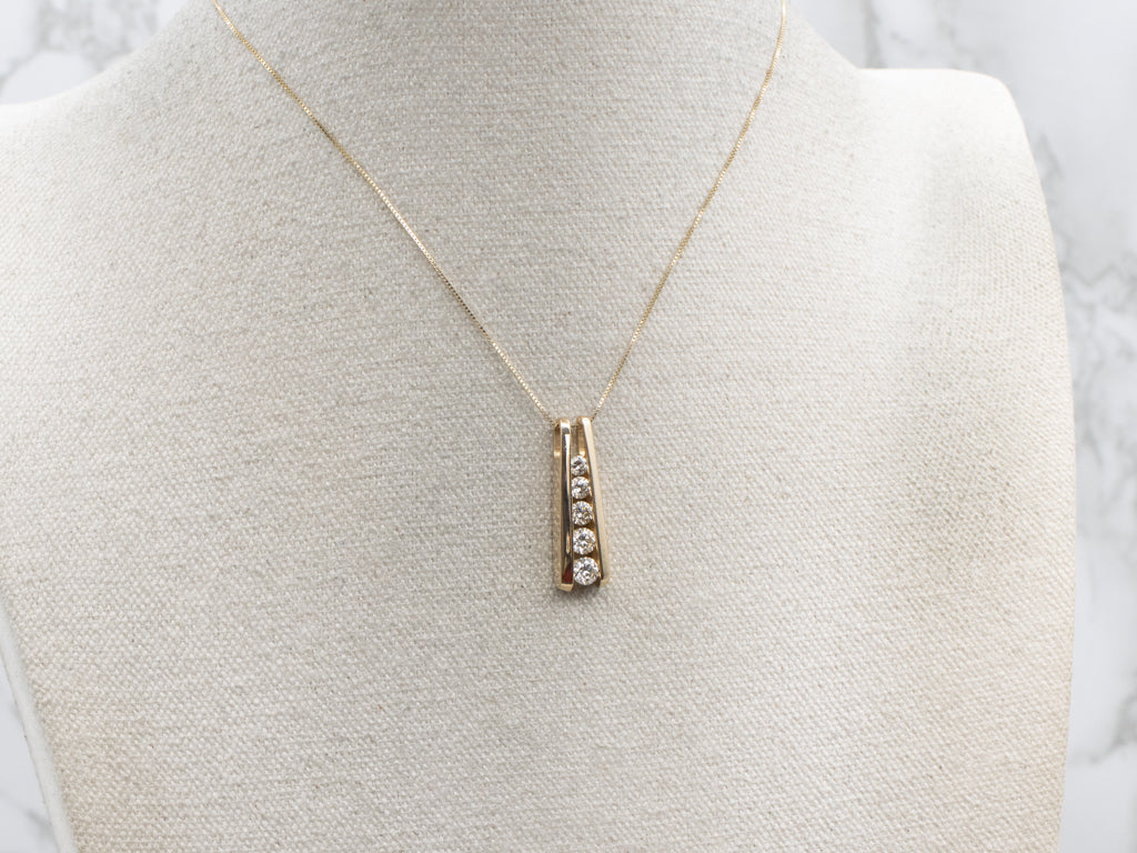 Tension-Set Diamond and Gold Pendant with Hidden Bail