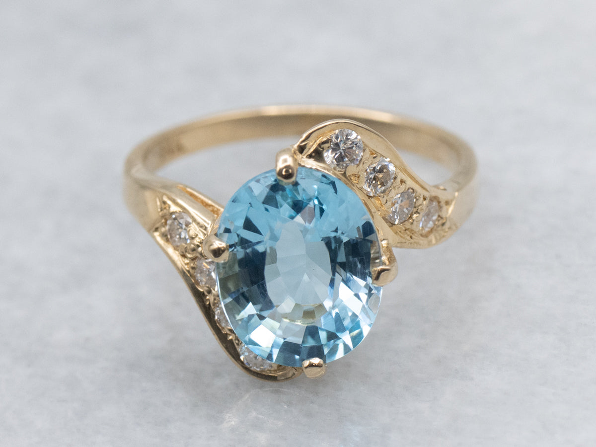 Blue Topaz and Diamond Yellow Gold Bypass Ring