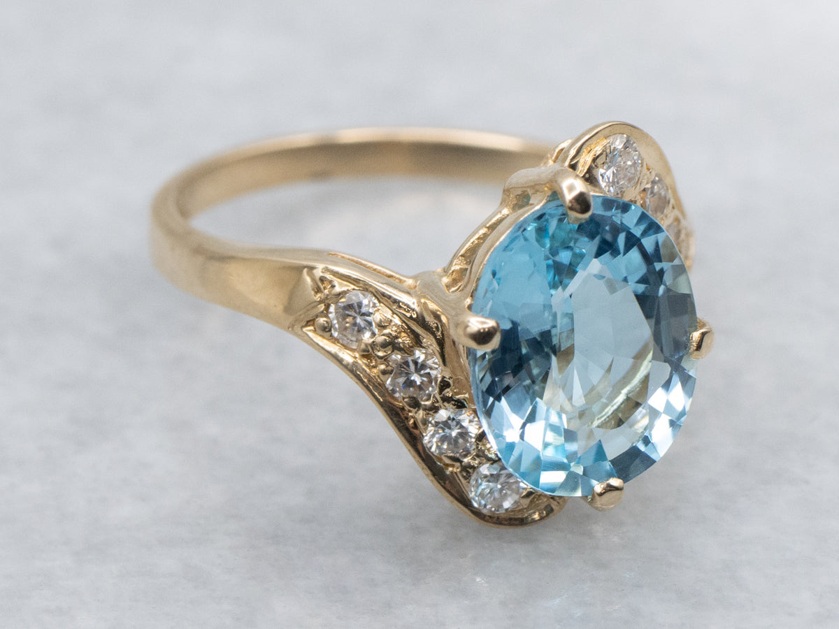 Blue Topaz and Diamond Yellow Gold Bypass Ring