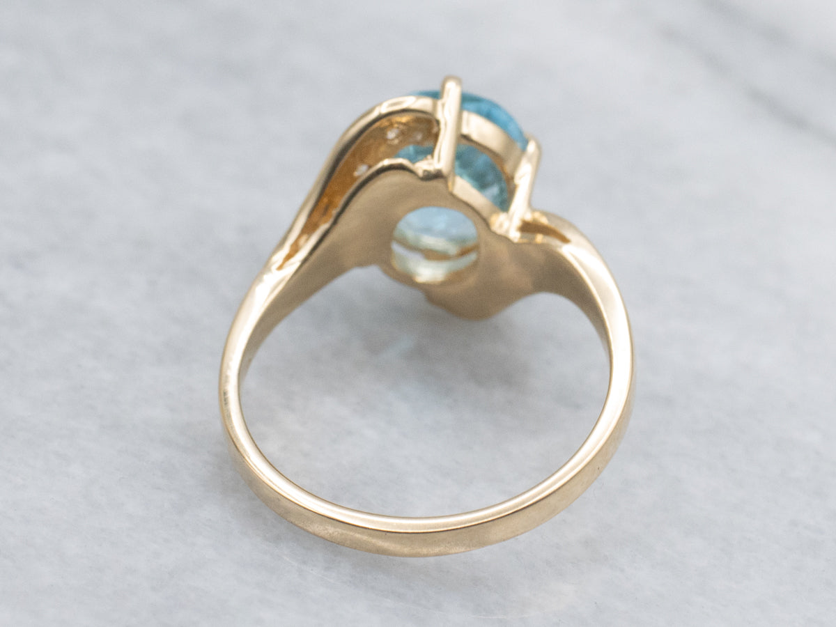 Blue Topaz and Diamond Yellow Gold Bypass Ring