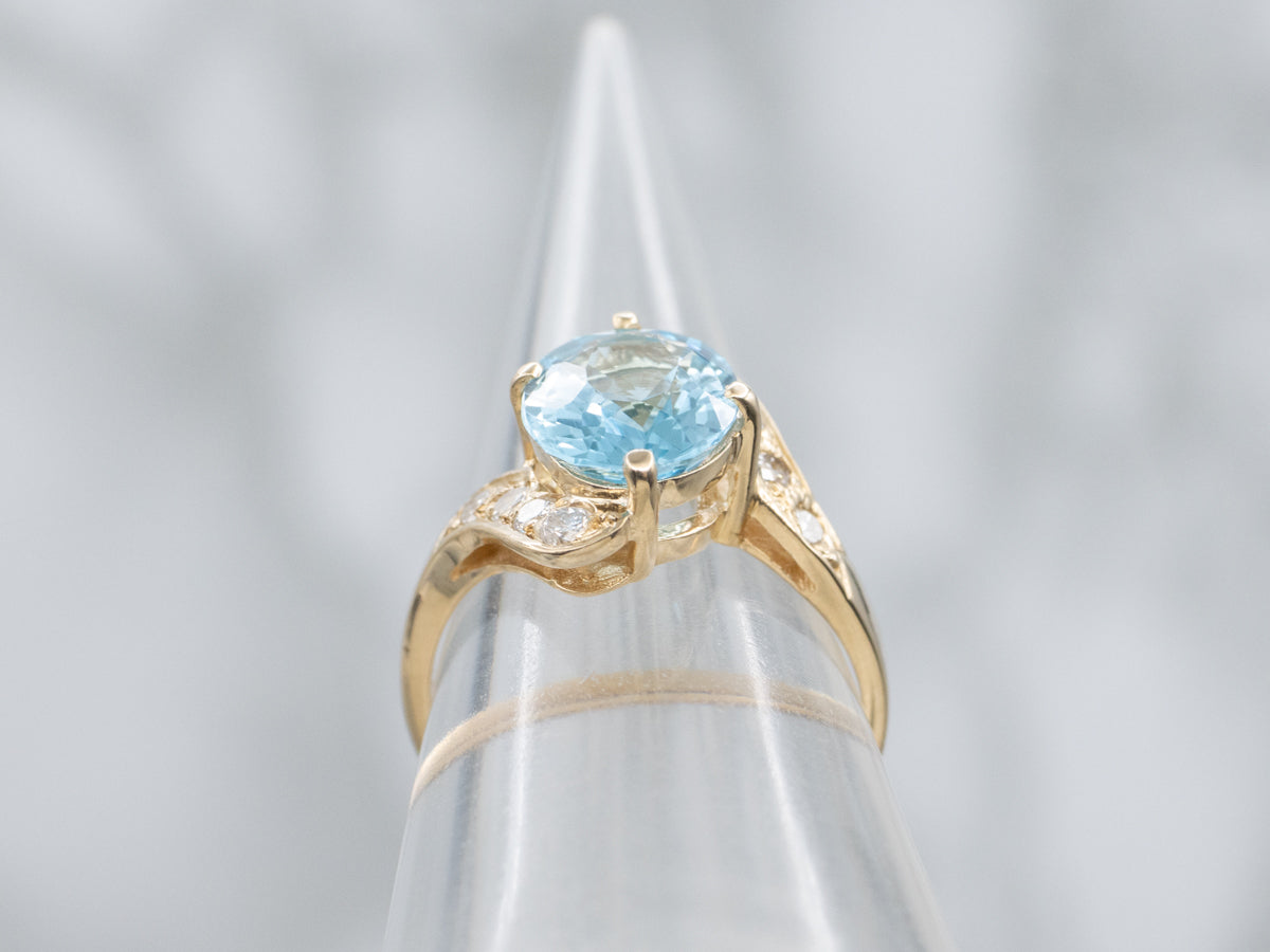 Blue Topaz and Diamond Yellow Gold Bypass Ring