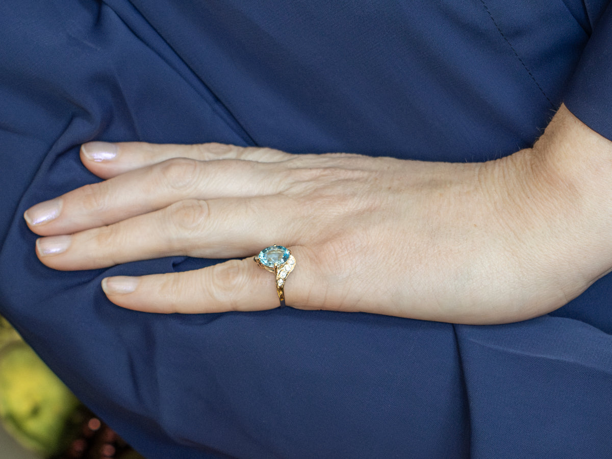 Blue Topaz and Diamond Yellow Gold Bypass Ring