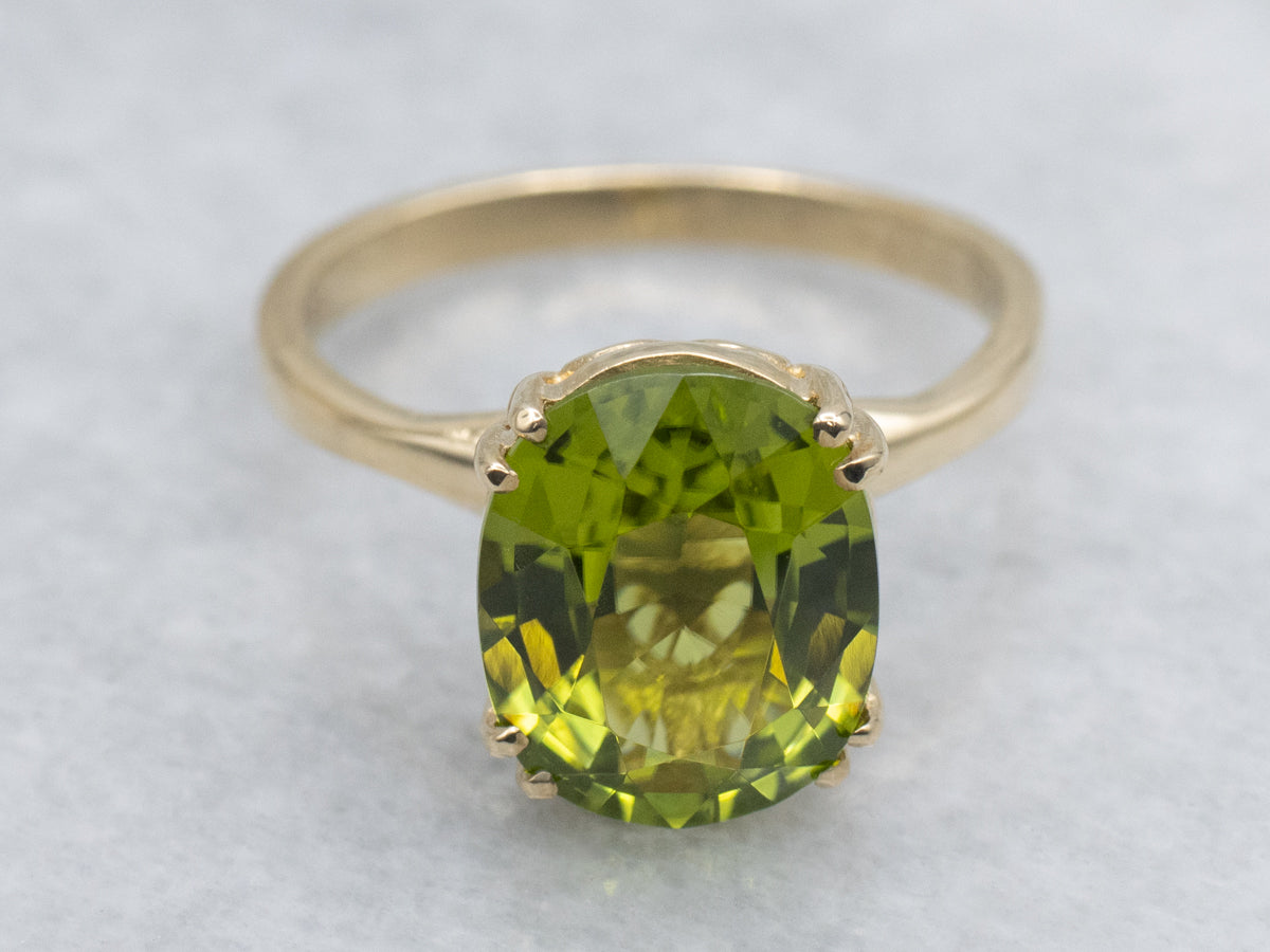 Oval-Cut Peridot Yellow Gold Solitaire Ring