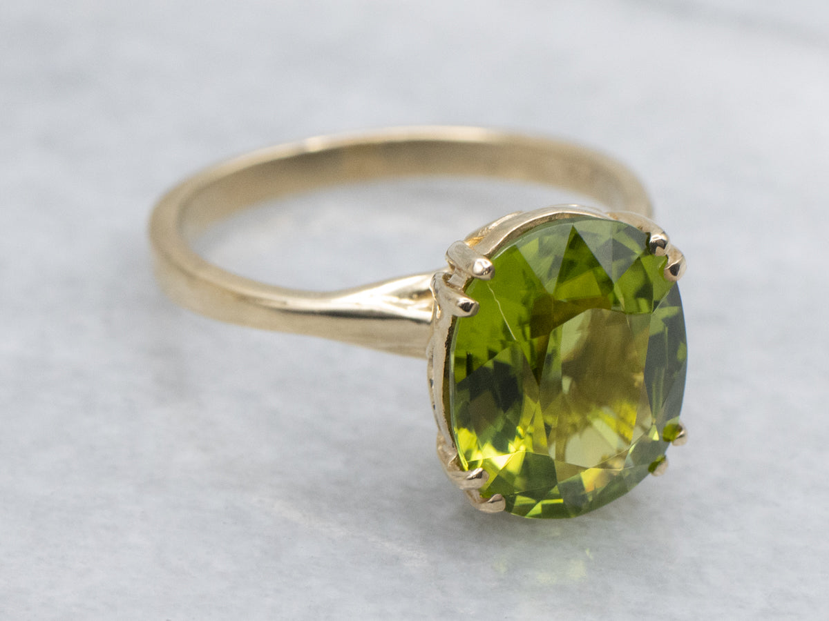 Oval-Cut Peridot Yellow Gold Solitaire Ring