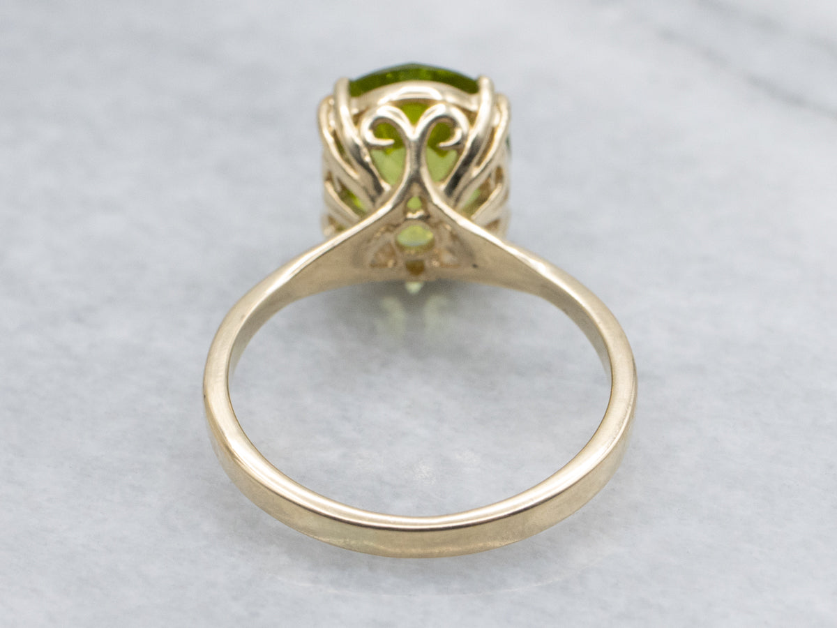 Oval-Cut Peridot Yellow Gold Solitaire Ring