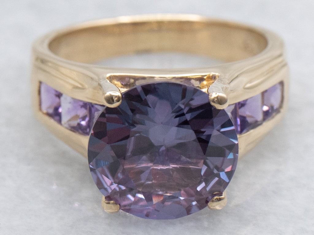 Synthetic Alexandrite Yellow Gold Cocktail Ring with Channel Set Amethyst Accents