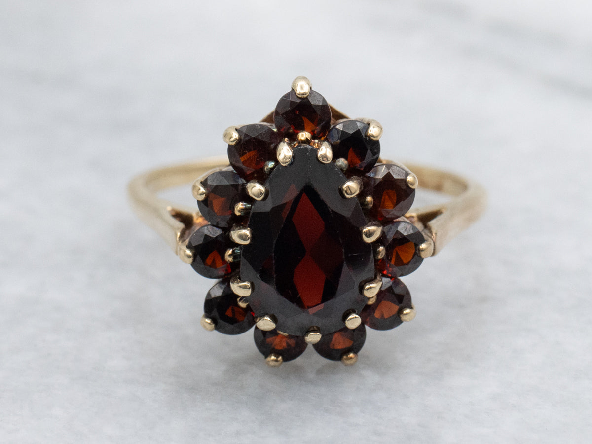 Pear-Cut Garnet and Gold Halo Cluster Ring