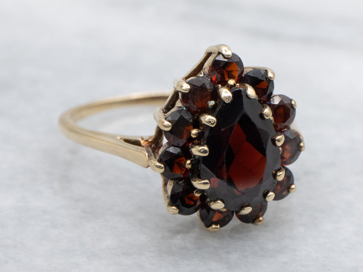 Pear-Cut Garnet and Gold Halo Cluster Ring
