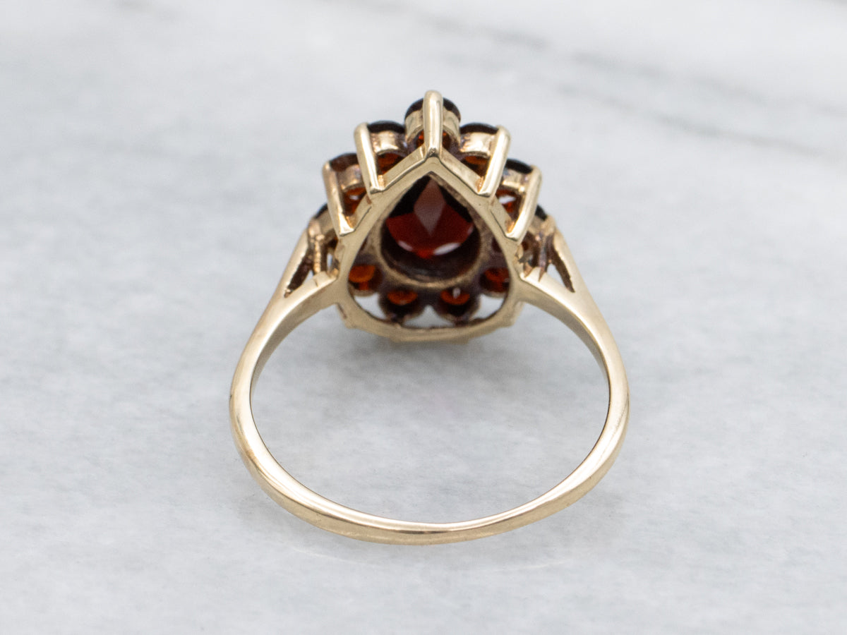 Pear-Cut Garnet and Gold Halo Cluster Ring