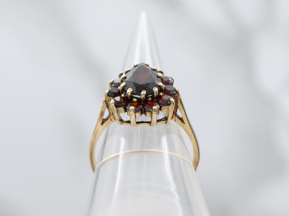 Pear-Cut Garnet and Gold Halo Cluster Ring