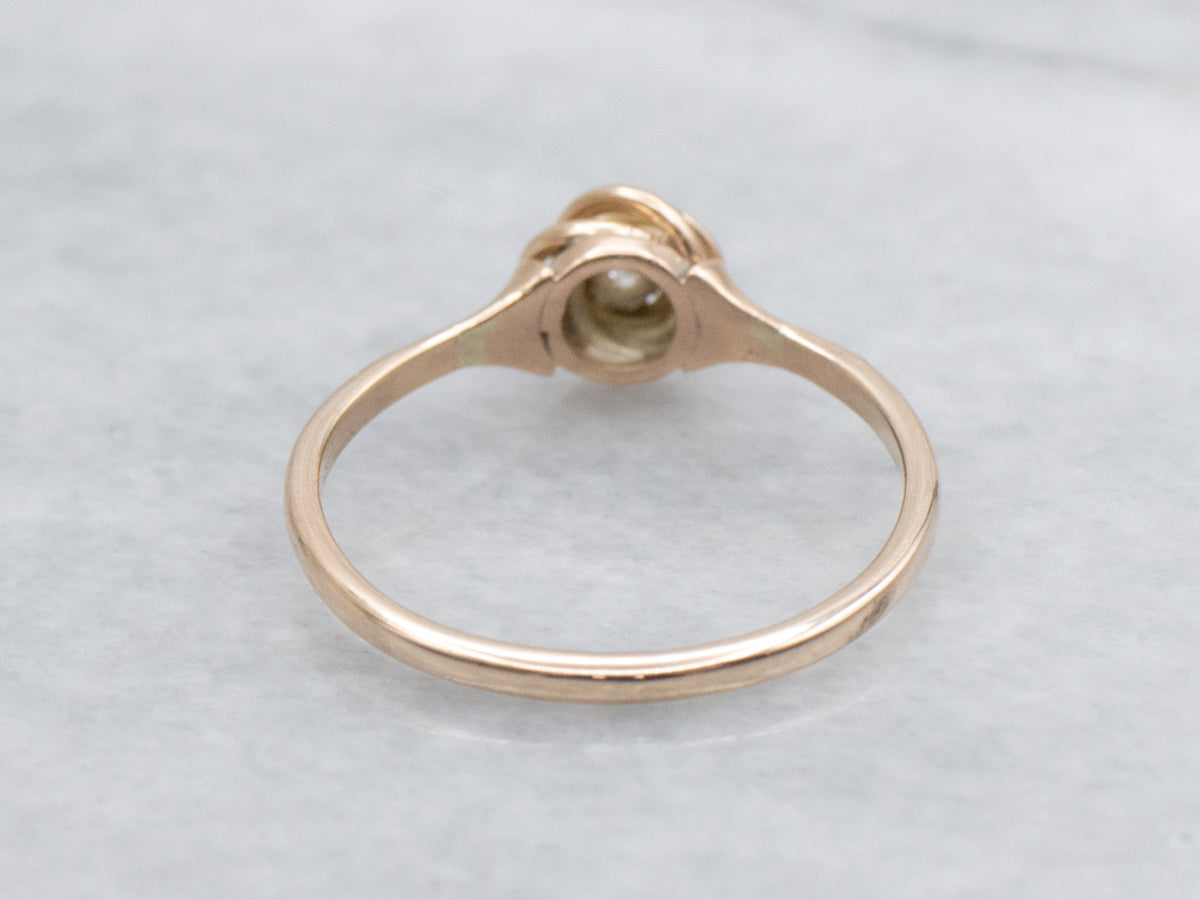 Twisting Rose Gold Diamond Solitaire Ring