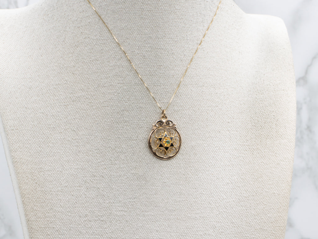 Buttercup-Set Emerald Doublet and Black Enamel Gold Star Pendant