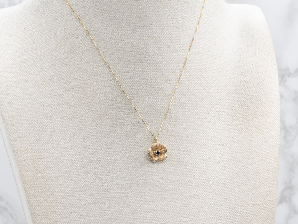 Textured Gold Flower Pendant with Sapphire Center