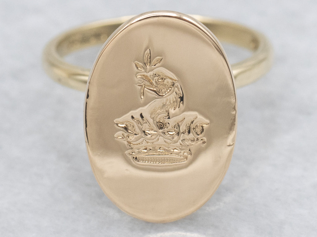 Antique Oval-Top Gold Signet Ring with Engraved Crest