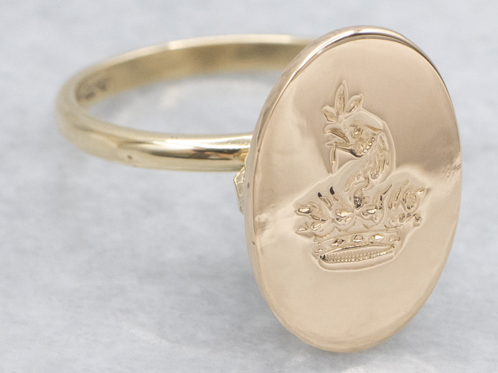 Antique Oval-Top Gold Signet Ring with Engraved Crest