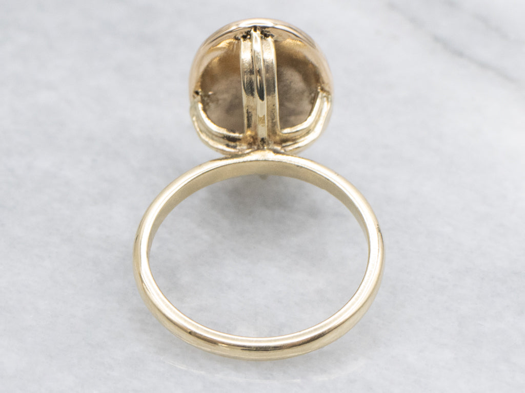 Antique Oval-Top Gold Signet Ring with Engraved Crest