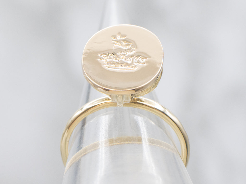 Antique Oval-Top Gold Signet Ring with Engraved Crest