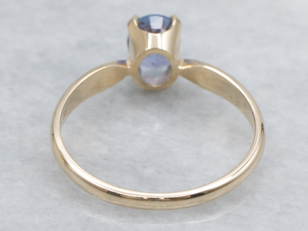 Oval-Cut Tanzanite Yellow Gold Solitaire Ring