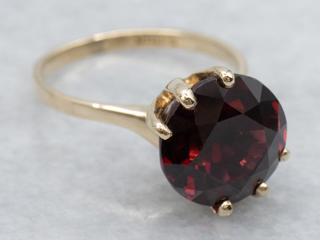 Garnet Gemstone in Twisting Yellow Gold Bypass Ring