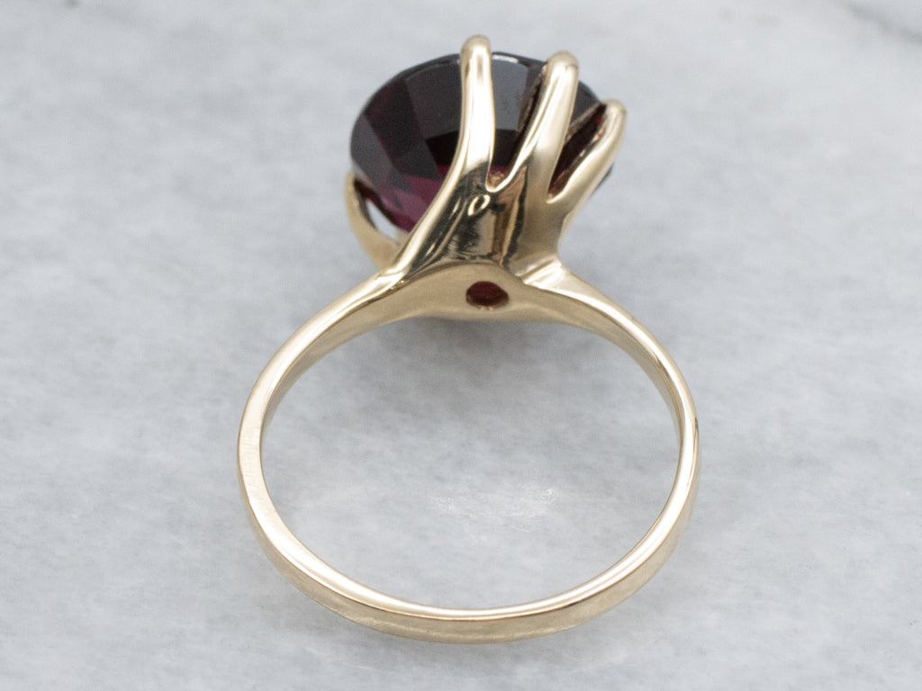 Garnet Gemstone in Twisting Yellow Gold Bypass Ring