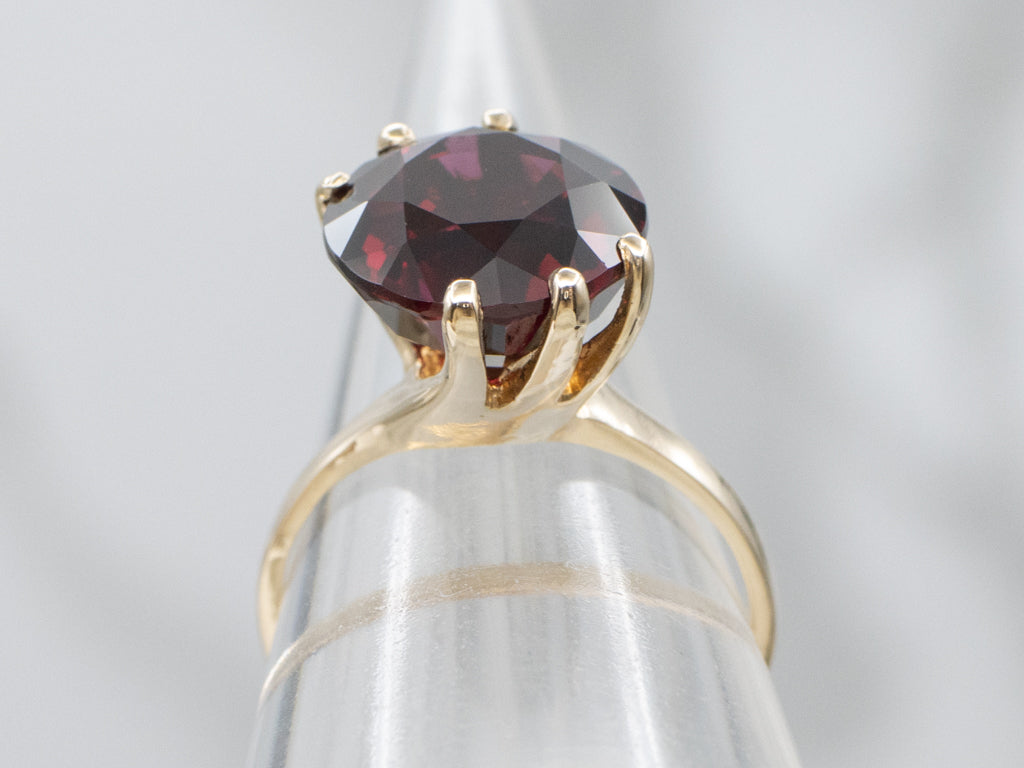Garnet Gemstone in Twisting Yellow Gold Bypass Ring