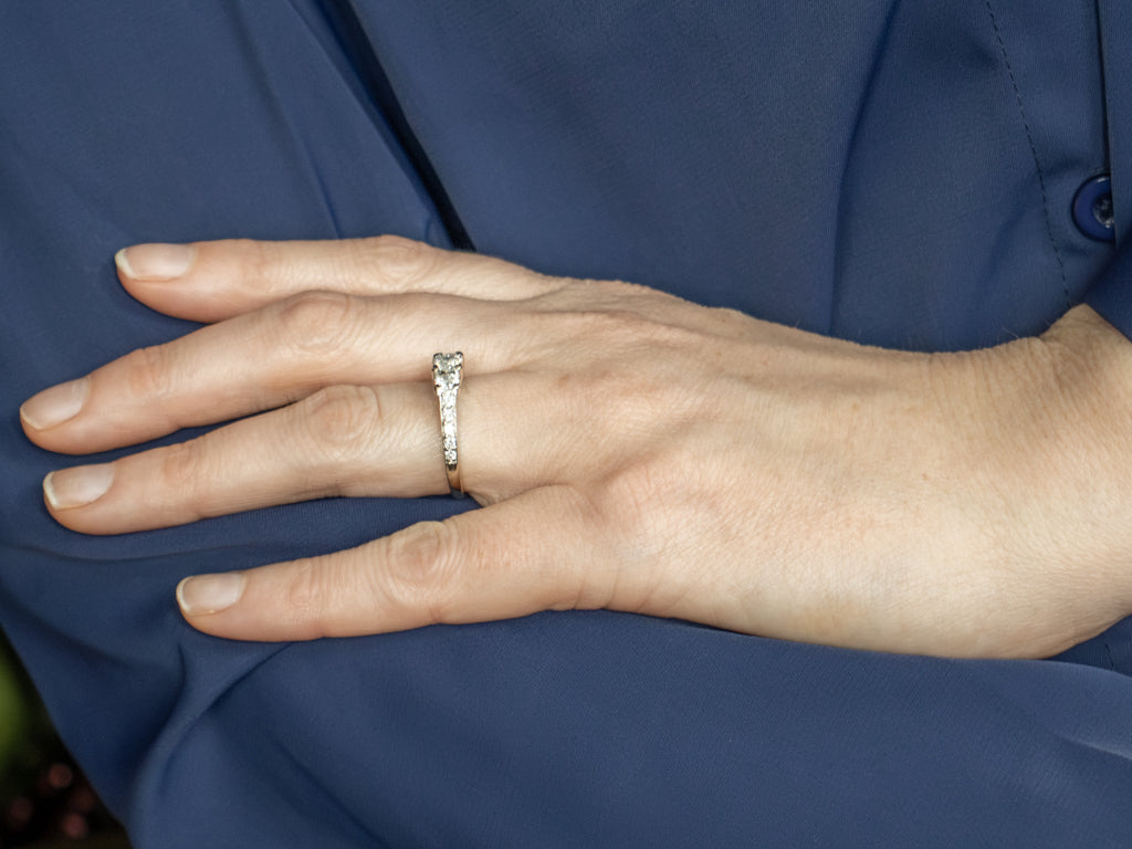 Modern Round Brilliant Three Stone Diamond Engagement Ring with Diamond Accents