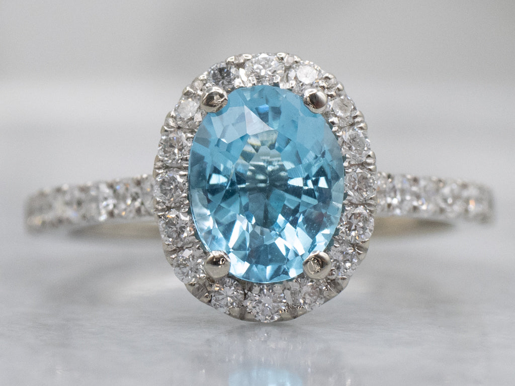 Modern Blue Topaz and Diamond Halo Ring