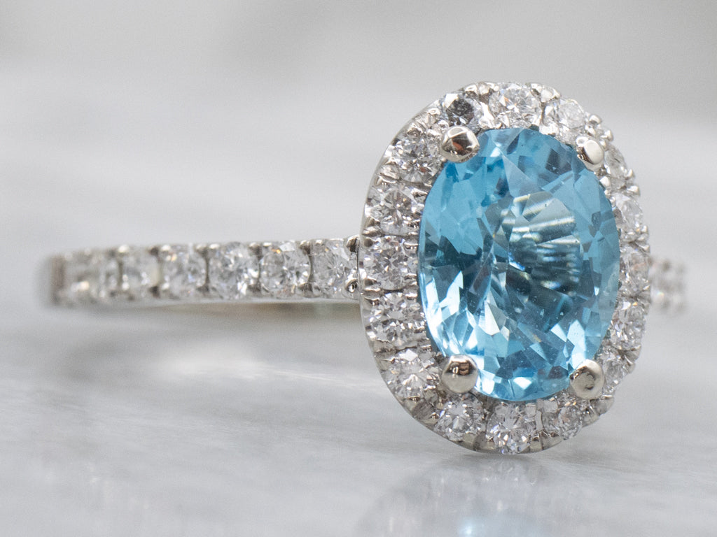 Modern Blue Topaz and Diamond Halo Ring