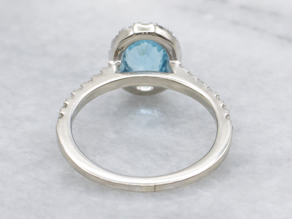Modern Blue Topaz and Diamond Halo Ring