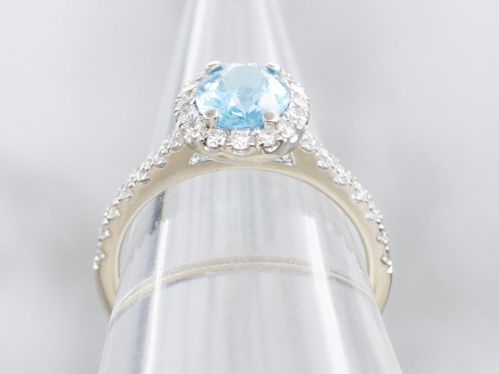 Modern Blue Topaz and Diamond Halo Ring